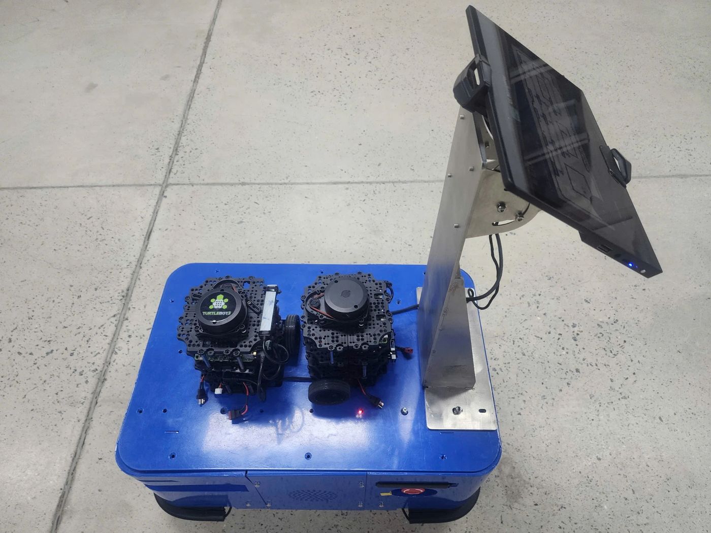 The FabLab AMR carrying two TurtleBot3 robots used in the fleet demos.